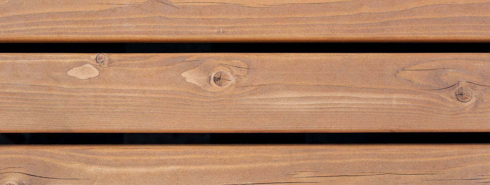 Heat-treated wood, also known as thermally modified wood, is lumber that has undergone a controlled pyrolysis process, where it is heated to high temperatures i