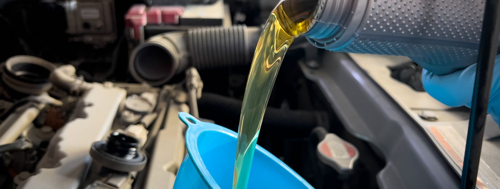 Engine oil is the lifeblood of your vehicle's engine. It serves as a lubricant, coolant, and cleaning agent, ensuring that the intricate parts of the engine wor