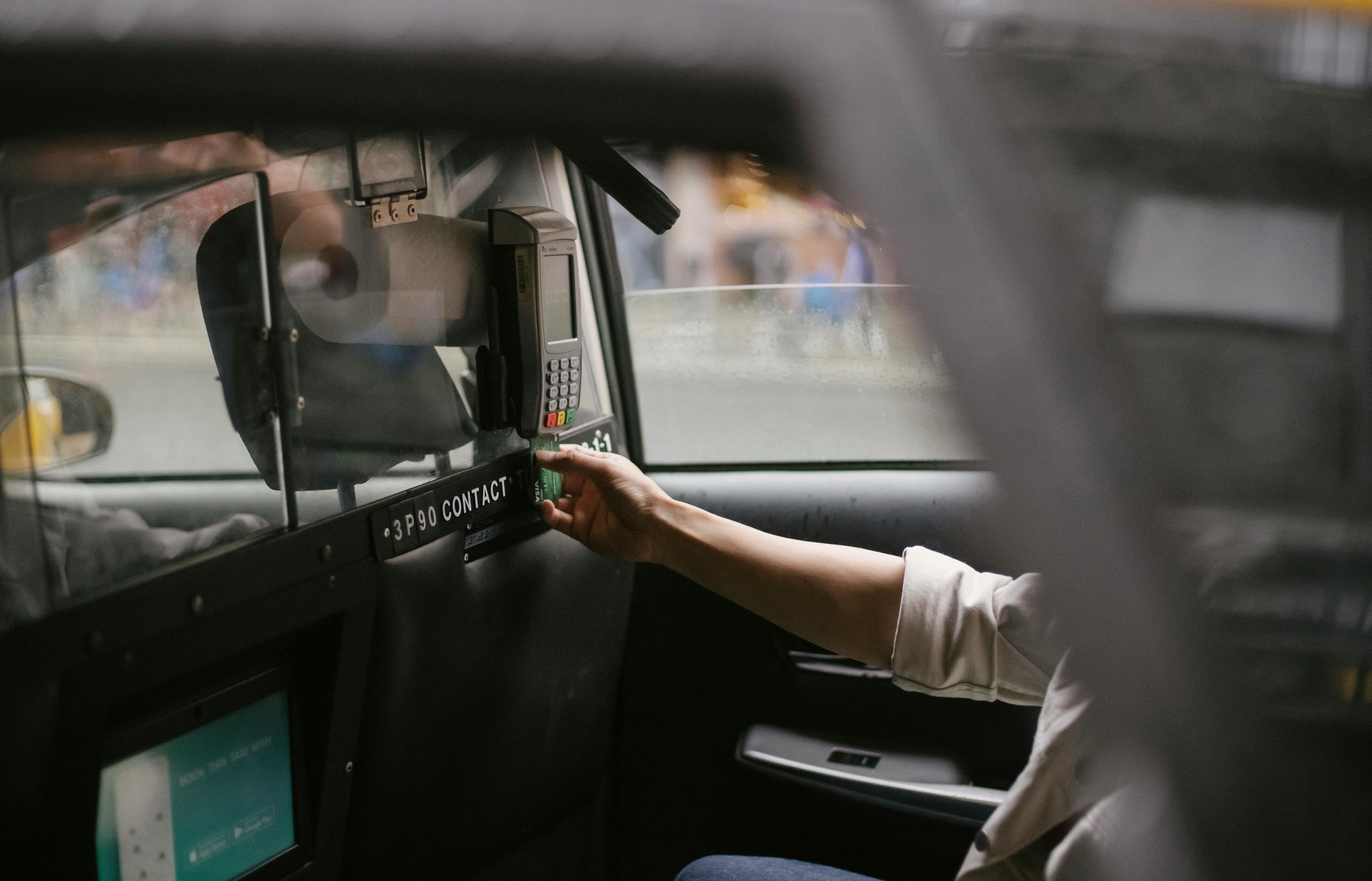 Card payment in a car  makes taxi, scheduled transport and business-transport payments faster and more reliable: travel is paid conveniently, securely and verif
